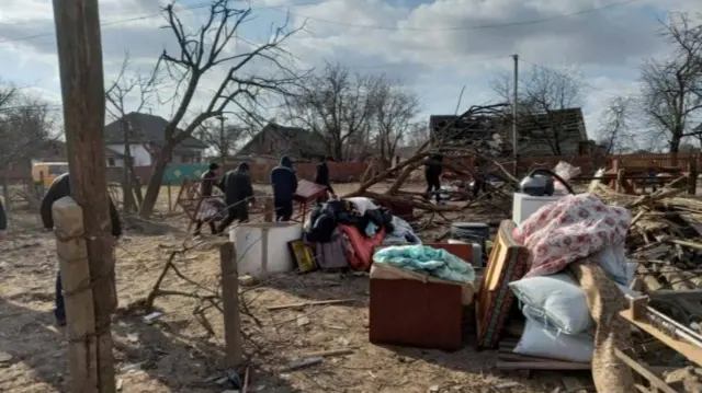 Damage in the village of Rakivshchyna, Zhytomyr region, was pictured on 24 March