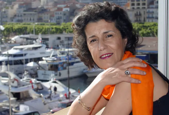 Algerian director Yamina Bachir-Chouikh poses for the photographer at the Palais des festivals before the screening of her film "Rachida" during the 55th Cannes film festival 21 May 2002.