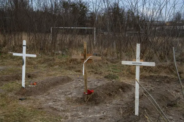 Graves with bodies of civilians, who according to local residents were killed by Russian soldiers, are seen, as Russia"s attack on Ukraine continues, in Bucha, in Kyiv region, Ukraine April 4, 2022