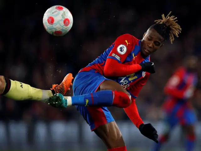 Crystal Palace's Ivorian striker Wilfried Zaha vies for the ball during the English Premier League football match between Crystal Palace and Arsenal at Selhurst Park in south London on April 4, 2022.