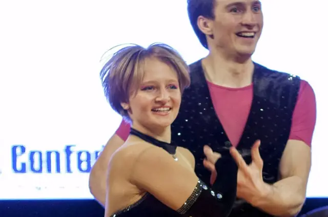 Katerina Tikhonova and a partner compete in a rock n roll dance competition