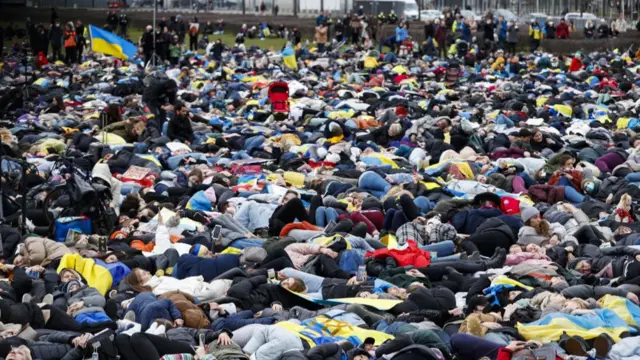 Thousands of Germans staged a protest in Berlin, where they lay on the ground as they imitated war victims