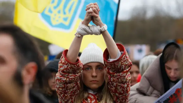 Protesters attend a demonstration in Berlin against the Russian invasion.