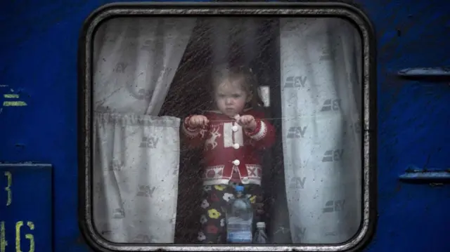 A child on a train at Kramatorsk central station.