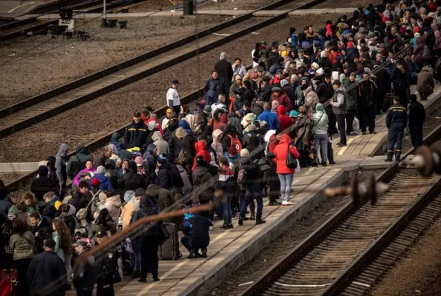 Families wait to board a train at Kramatorsk central station, Donbas