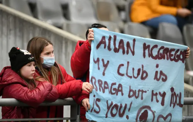 A Braga fan holds up a banner for Allan McGregor