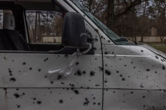 Closeup of bullet-riddled vehicle in Bucha