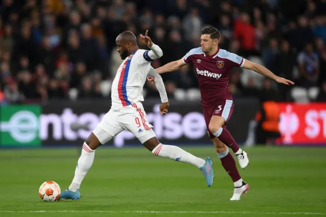 Aaron Cresswell fouls Moussa Dembele.