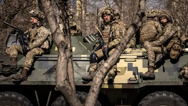 Ukrainian soldiers sit on a military vehicule in Severodonetsk, Donbas region.