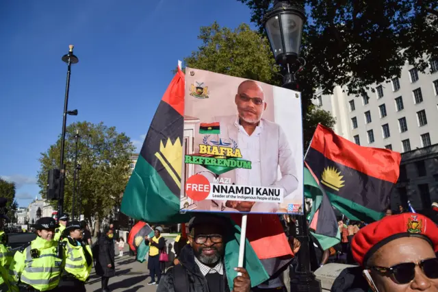 A protester holds a picture of Nnamdi Kanu during the demonstration