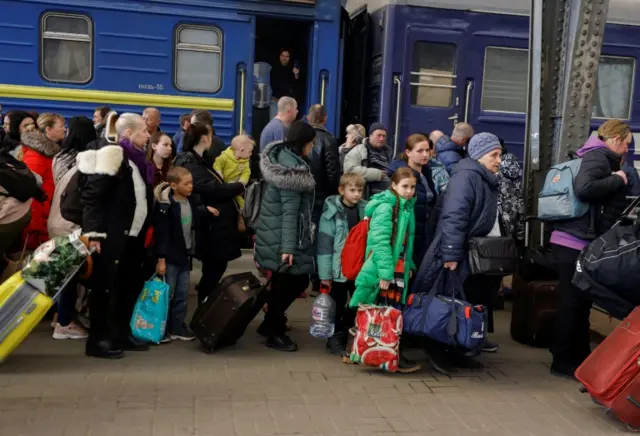 People disembark a train from Kramatorsk at Lviv train station