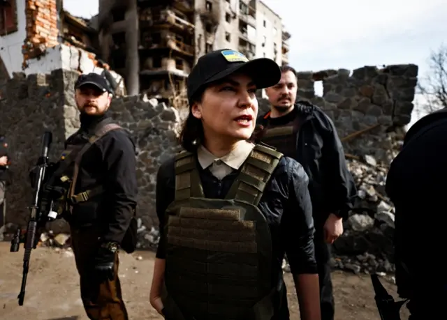 Ukraine's Prosecutor General Iryna Venediktova with her team of investigators and guards on the streets of Borodyanka