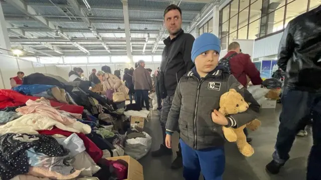 Boy clutches a teddy bear at a refugee centre in Zaporizhzhia