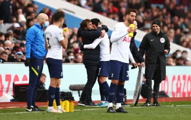 Conte hugs Son