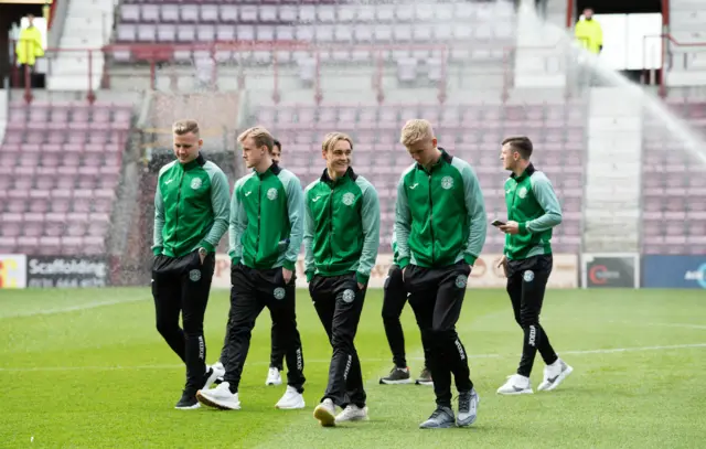 Hibs players check out the Tynecastle surface