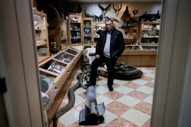 Director of the Mykolaiv zoo Volodymyr Topchy shows the remains of a rocket following bombing, amid Russia"s invasion of Ukraine, in Mykolaiv