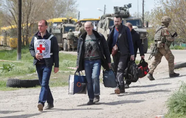 People arrive at a temporary accommodation centre in the village of Bezimenne in the Donetsk region