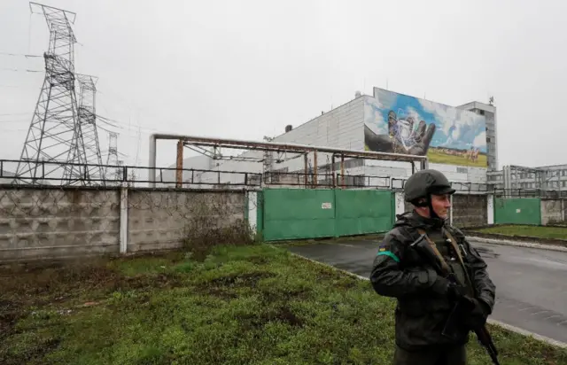 A Ukrainian soldier guarding the Chernobyl plant, 26 Apr 22