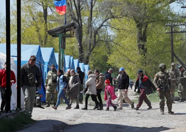 People arrive at a temporary accommodation centre in the village of Bezimenne in the Donetsk region