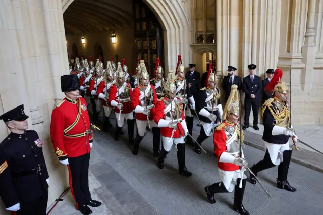 Members of the Household Cavalry arrive through the Sovereign's Entrance ahead of the State Opening of Parliament at Houses of Parliament on May 10, 2022 in London, England