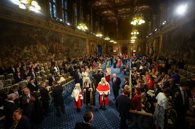 Invited guests take their seats at the Royal Gallery before the State Opening of Parliament in the House of Lords at the Palace of Westminster on May 10, 2022 in London, England