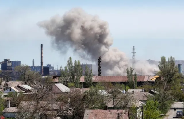 A cloud of smoke rises from an explosion at the Azovstal steelworks plant