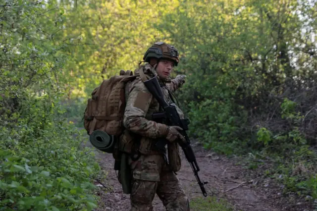 A Ukrainian soldier on patrol in the Kharkiv region