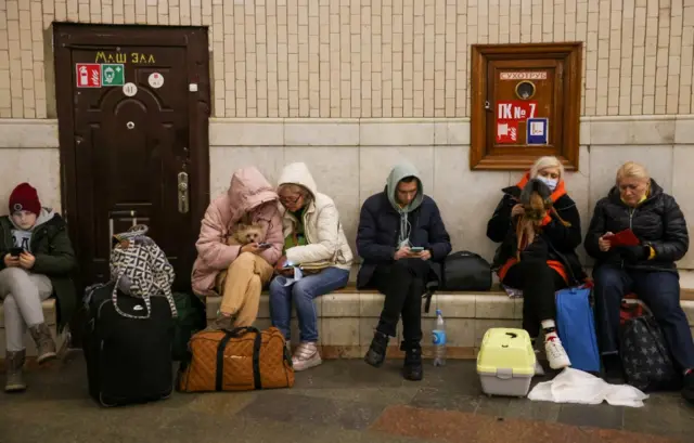 Civilians take shelter in a Kyiv metro station