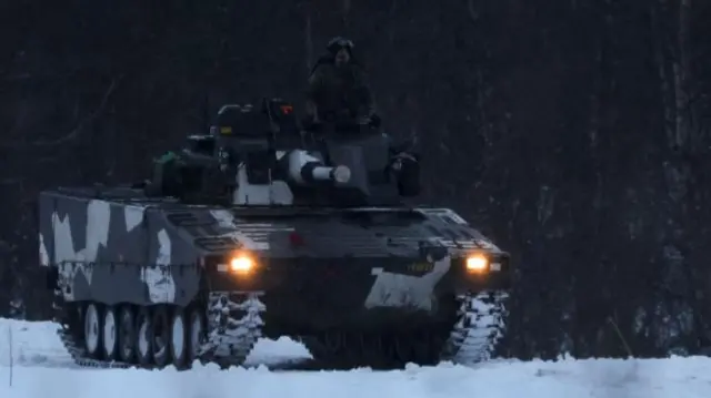 swedish troops drive a vehicle during exercises in Norway