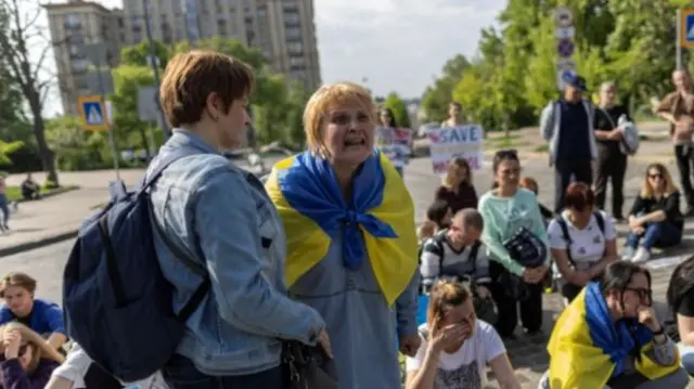 Relatives of fighters stuck in the Azovstal steel plant in Mariupol rally to demand a rescue mission near the presidential palace in Kyiv