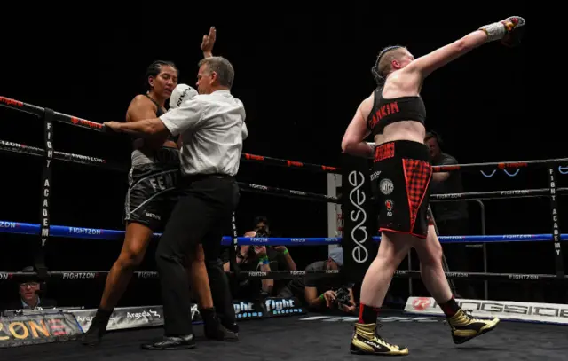 A triumphant Rankin punches the air in joy after the stoppage