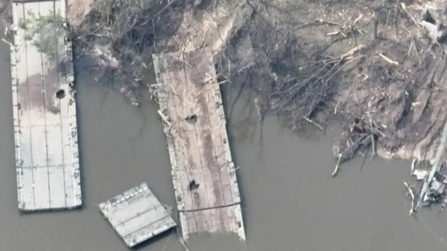 The remains of what appears to be a makeshift bridge across the Siverskyi Donets River