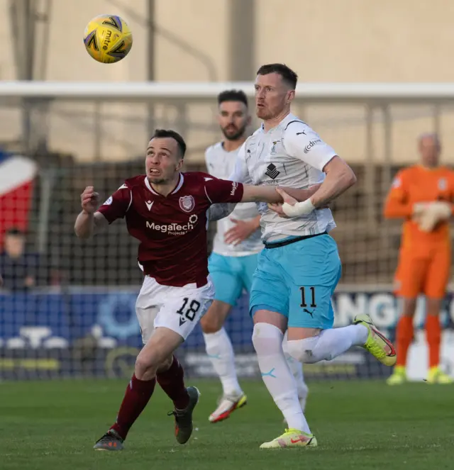 Chris Hamilton and Shane Sutherland chase the ball