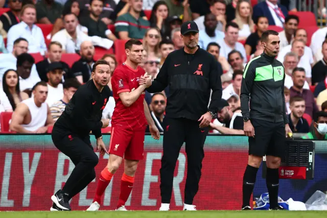 James Milner and Jurgen Klopp.