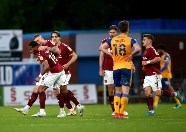 Northampton celebrate their goal at Mansfield