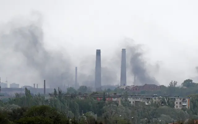 Smoke rises above a plant of the Azovstal Iron and Steel Works