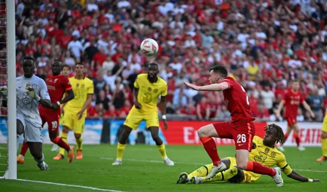 Andy Robertson hits the post for Liverpool.