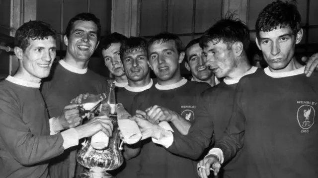 Liverpool players pour milk in the FA Cup in 1965