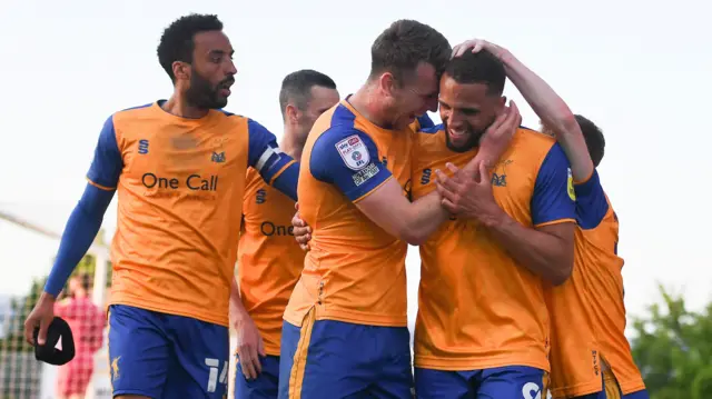 Mansfield celebrate their second goal against Northampton