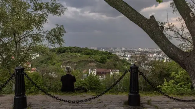 A man looks in the direction of Kyiv, Ukraine