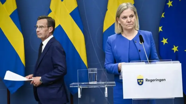 Sweden's Moderate Party's leader Ulf Kristersson give a news conference in Stockholm alongside Sweden's Prime Minister Magdalena Andersson