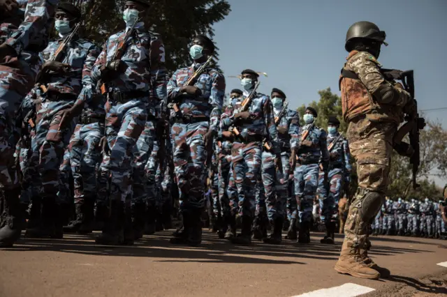 Malian military personnel parade in front of the heads of the transitional government during a ceremony celebrating the army's national day, in Kati, on January 20, 2022.