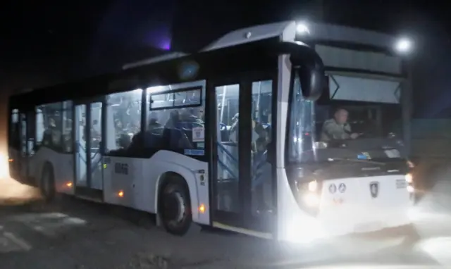 Reuters news agency said this picture shows one of the buses carrying fighters from the steel works - the BBC cannot independently verify this