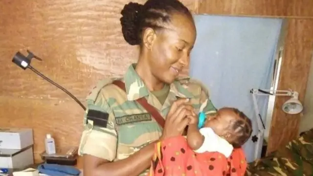 Captain Mwila Chansa with baby Thabo