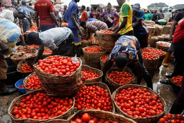 People buy and sell vegetables at Mile 12 International Market in Lagos, Nigeria May 13, 2022