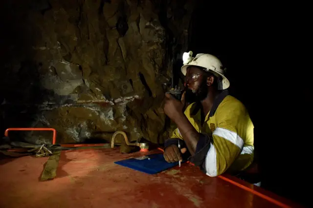 A man works during a rescue operation inside Perkoa mine where water is still being pumped out, four weeks after a flood trapped eight miners inside the galleries, in Perkoa