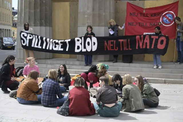 People protest against Swedish membership in Nato, outside the parliament in Stockholm,