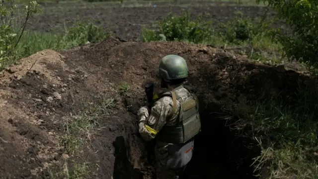 Ukrainian serviceman Shaba stays at a trench used as an observation point at a frontline area in Ruska Lozova, a village retaken by the Ukrainian forces, amid Russia's attack on Ukraine, in Kharkiv region