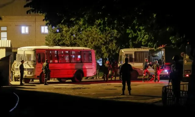 Buses said to be carrying Ukrainian fighters from the besieged Azovstal steelworks arrive in Novoazovsk, Ukraine