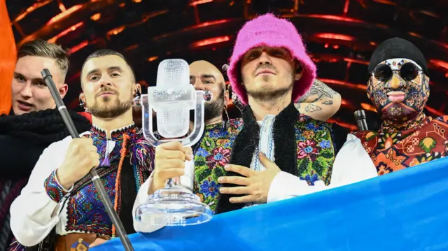 Oleg Psiuk holds the Eurovision trophy after winning the song contest on Saturday